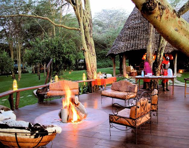 Intimate resort deck arranged around a warm outdoor fire